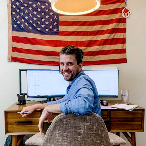Picture of Mark Rindom at his desk
